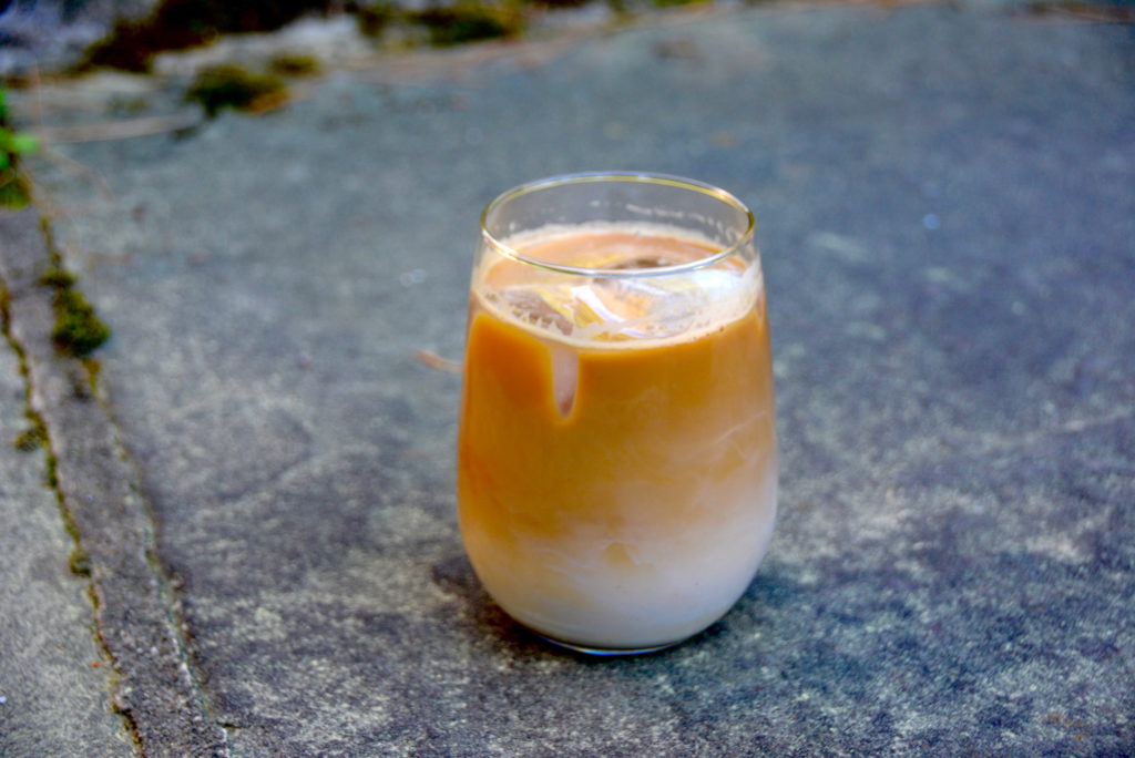 cold brew coffee with milk on pavement