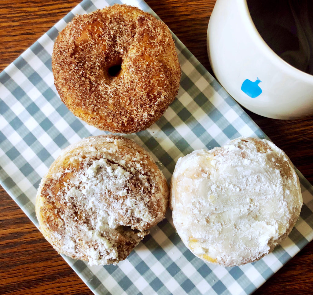cinnamon sugar donut and powdered sugar donut with blue bottle coffee