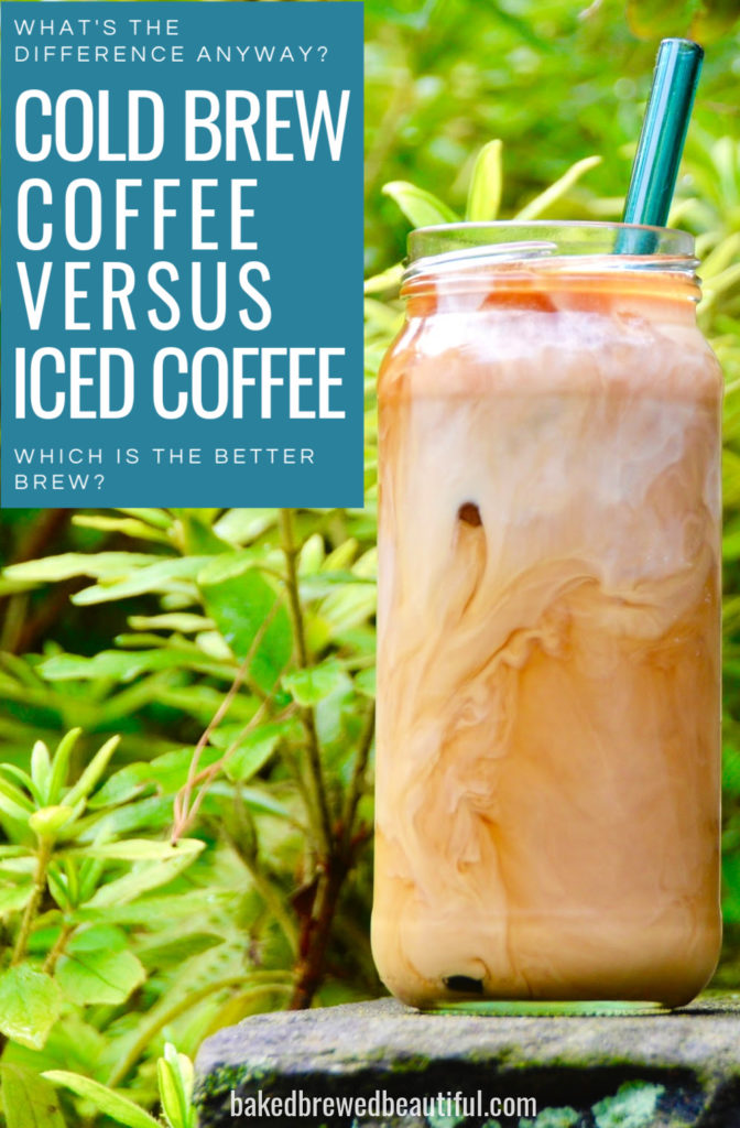 cold brew in mason jar filled with cold brew and milk and a straw. Greenery for the background 