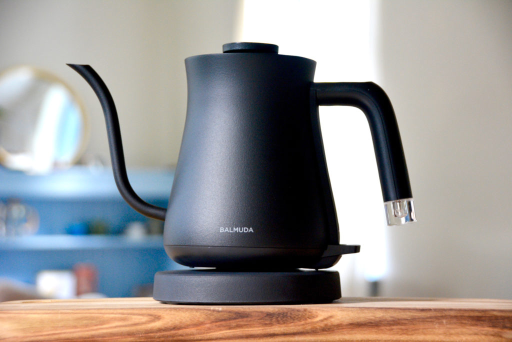 Balmuda the Kettle on Table with coffee bar in background