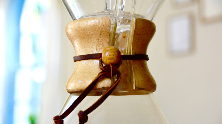 close up Chemex filled with coffee on a table top