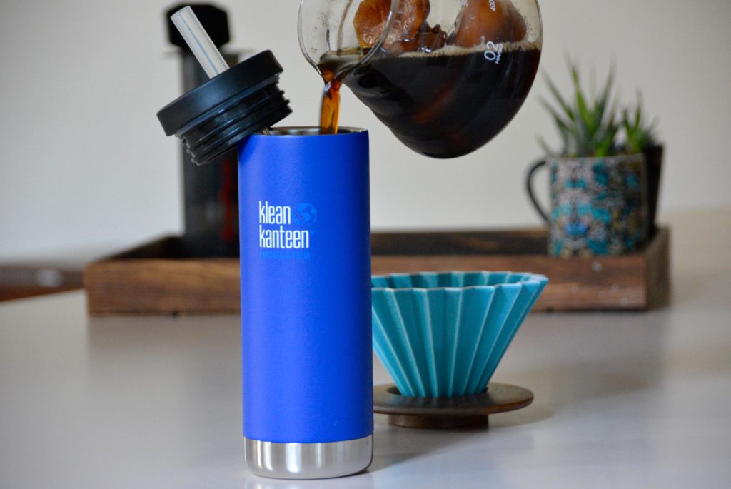 one blue klean Kanteen travel mug and an origami dripper