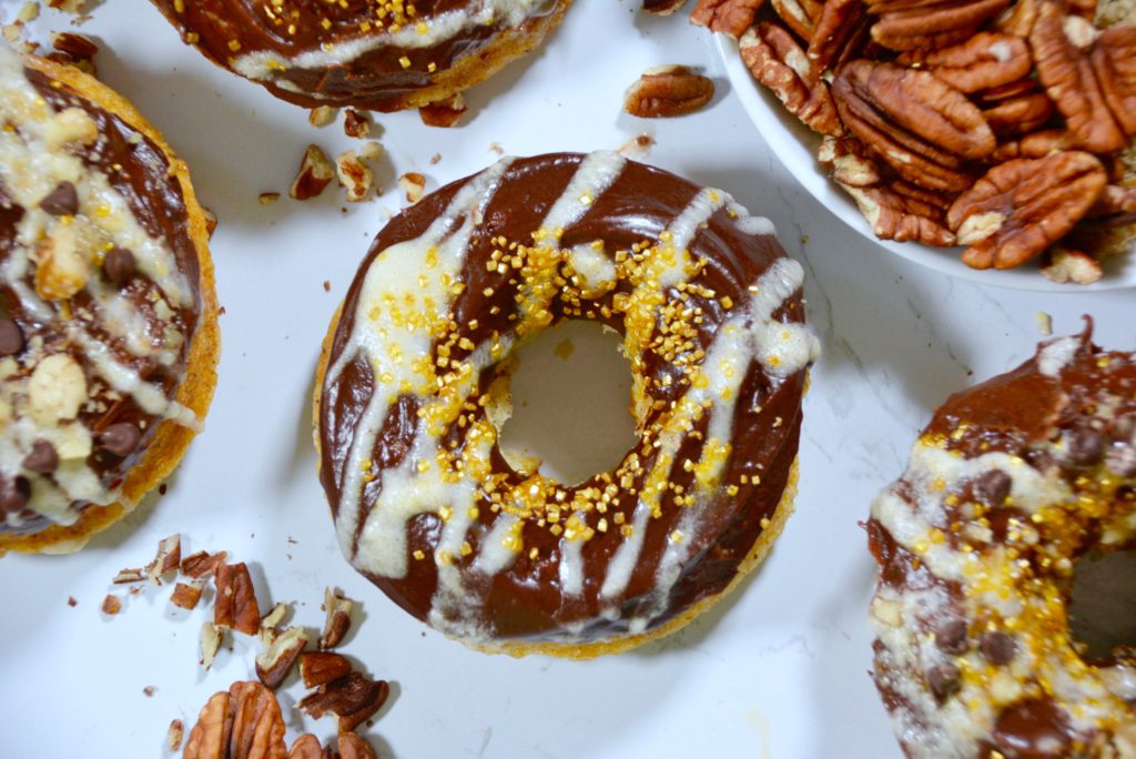 chocolate frosted donuts with gold and white