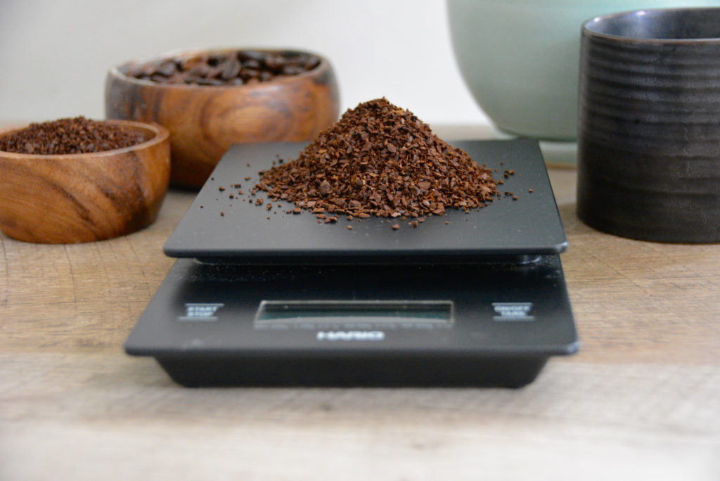 coffee scale with coffee grounds on top