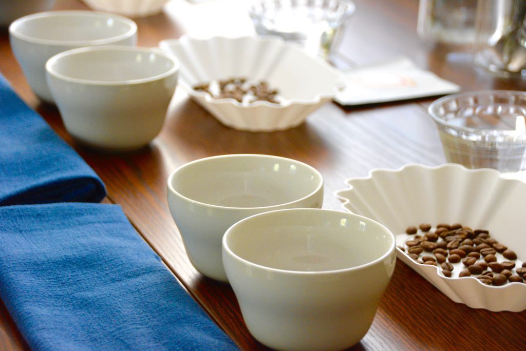 cupping coffee table set up with tasting trays and cups