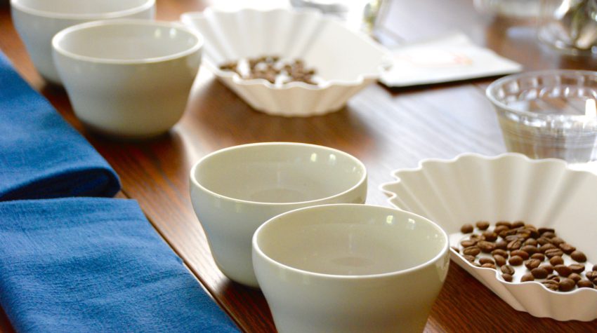 cupping coffee table set up with tasting trays and cups