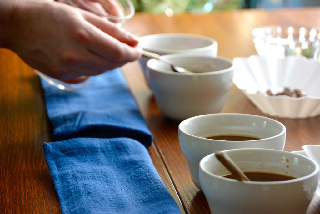 tasting spoons in tasting cups for coffee cupping