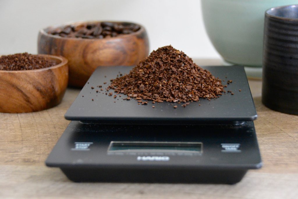 coffee hario scale with coffee grounds on top