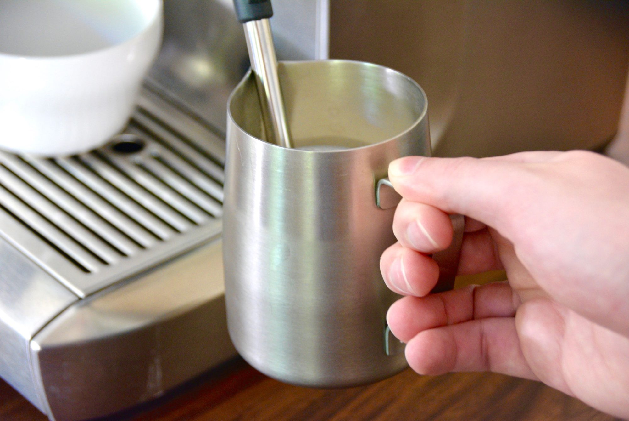 milk frothing pitcher with steam wand