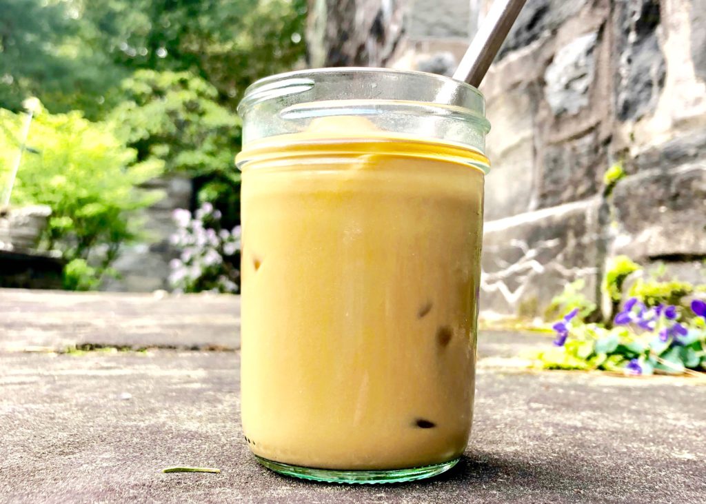 iced coffee on concrete in spring