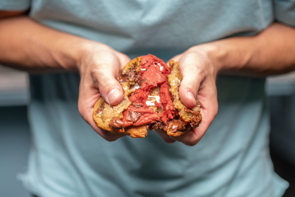 Bell's Cookies being broken in man's hands