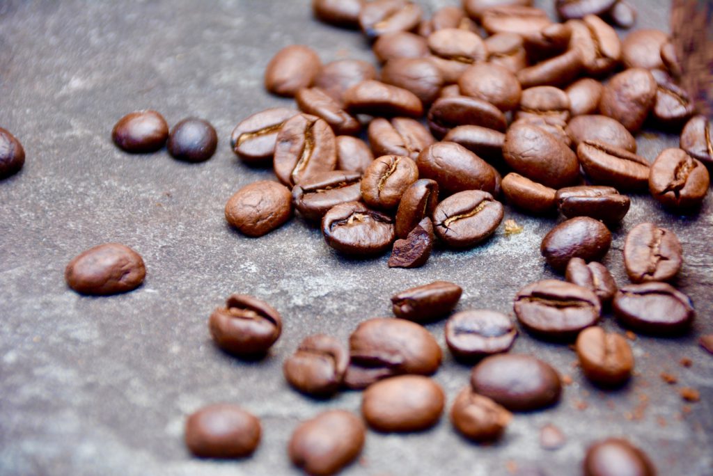 spilled coffee beans on cement