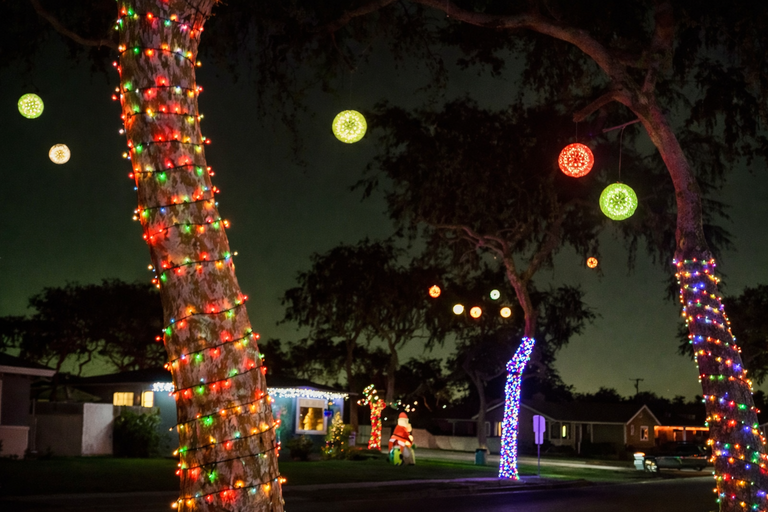 Sparkle Ball lights glowing in a residential Fullerton neighborhood at night